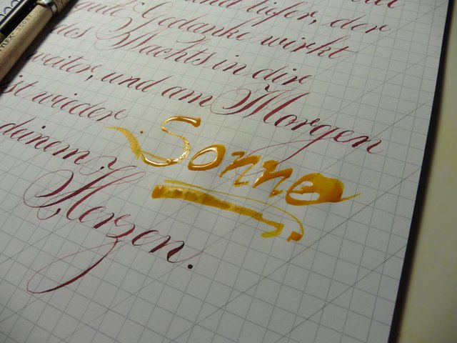 Sonne mit Colafeder geschrieben